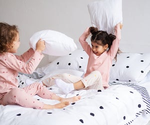 Did you know a pillow fight is a great way to get proprioceptive input? Photo by Mommy Poppins