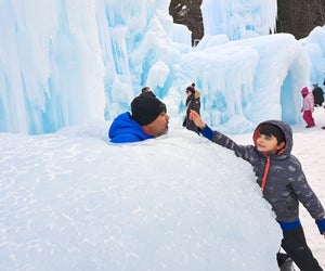 Ice Castles New Hampshire makes for a great winter day trip. Photo by Katherine Dhurandhar